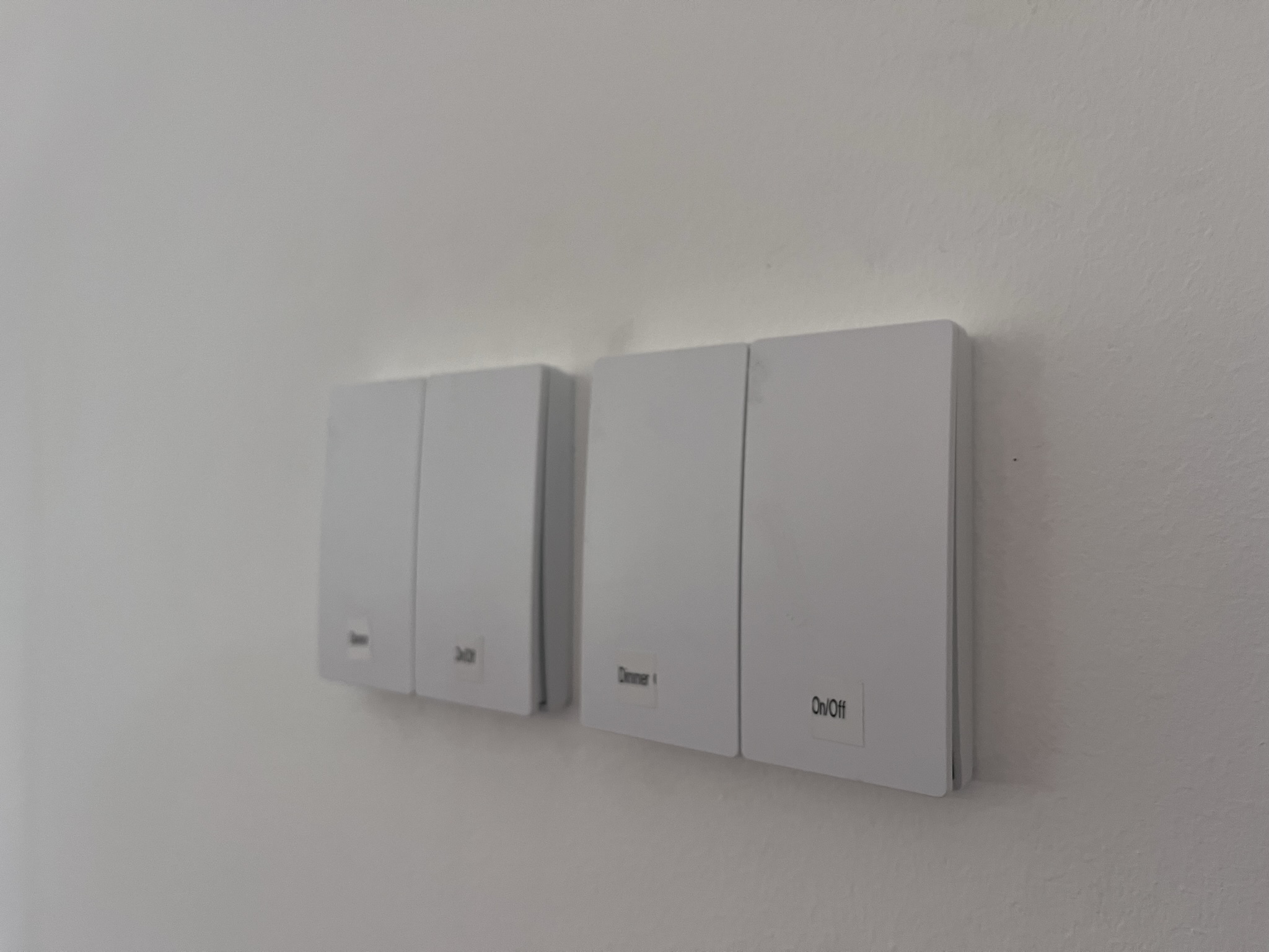 Light switches being used to dim lighting. Switches are stuck on and have no wires running to them. 